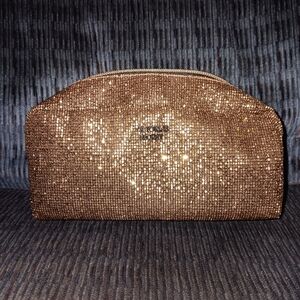 Victoria Secret shimmer rose gold makeup bag. Small